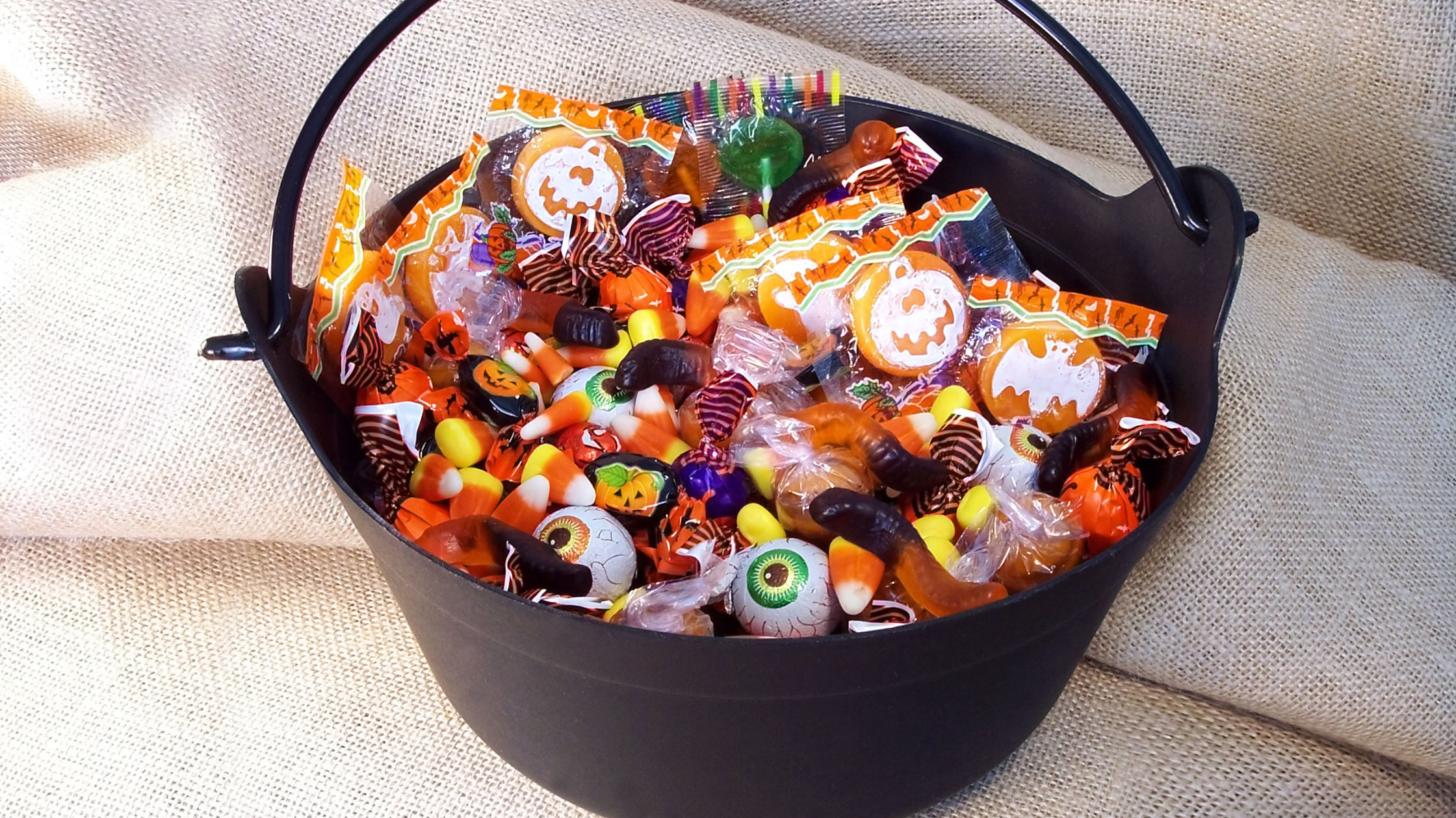 Child's bucket of halloween candy ready for sorting